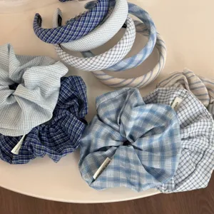Blue plaid and striped headband scrunchie set detail view showcasing various cute hair accessories.