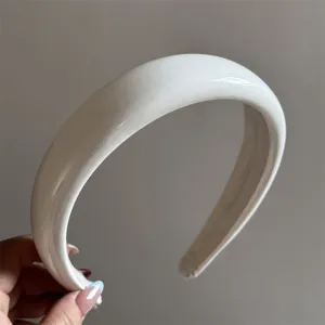 White patent leather padded headband detail, glossy thick hair hoop for women everyday style.