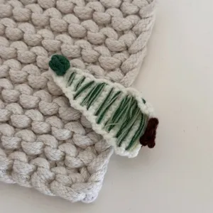 Handcrafted knitted Christmas tree hair clip for cute kids and girls sweet daily wear.