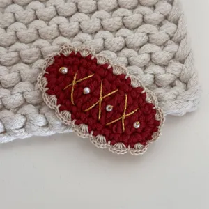 Handcrafted crochet wool hair clip with sweet pearl and embroidery details for cute girls.