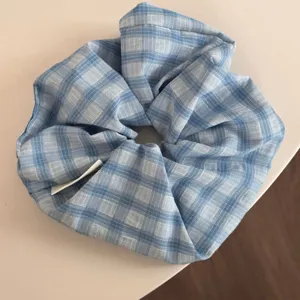 Blue and white plaid hair scrunchie, elegant retro fabric hair tie for women daily wear.