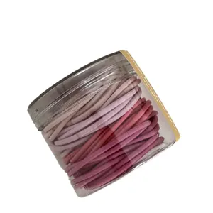 Gekleurde haarelastiekjes in doorzichtige bewaarpot, elastische paardenstaart haarbanden.