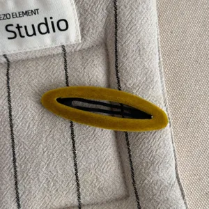 Mustard yellow velvet BB hair clip detail shot, elegant vintage side hair clip for women.