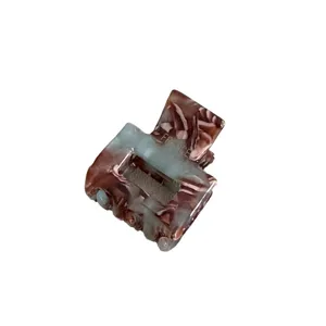 Mini acetate hair claw clip in brown blue marble, main view of small square hair accessory.