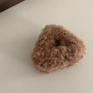 Brown plush hair claw clip for women, fluffy mini hair accessory for cute daily hairstyles.