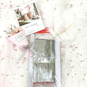 Silver tinsel fringe curtain backdrop for birthday party, wedding decoration and festive events.