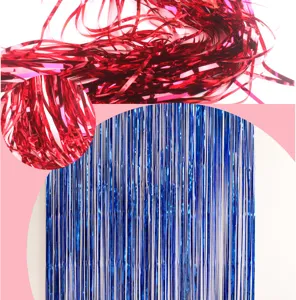 Close up detail of metallic tinsel curtain for party background, shiny foil fringe decoration.