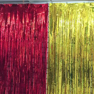 Red and gold foil fringe curtains, perfect backdrop for weddings and holiday party stage decor.