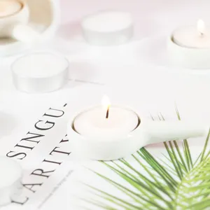 White ceramic tea light candle holder with handle, minimalist aromatherapy accessory for home decor