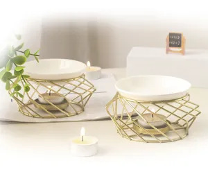 Kreative goldene Eisen-Aromalampe mit Keramikschale, ideal für Raumduft und Kerzendeko.