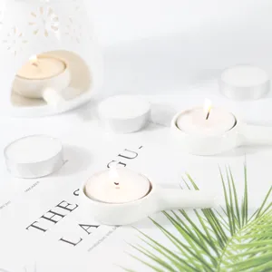 White ceramic oil burner aroma diffuser and tea light candle holder detail view.