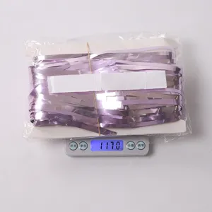 Purple foil fringe curtain detail shot, perfect for birthday party and dance party decor.