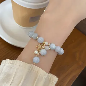 Close-up detail of the sweet blue chalcedony bead bracelet featuring a cute starfish charm.