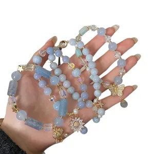 Chic blue chalcedony beaded bracelet set for women, featuring elegant butterfly and flower charms.