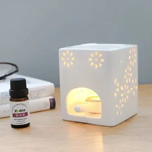 Lampe d'aromathérapie creuse en céramique blanche brûleur d'huiles essentielles déco
