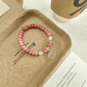 Bracelet de perles abaque en quartz rose doux avec pendentif boucle de paix pour femmes.