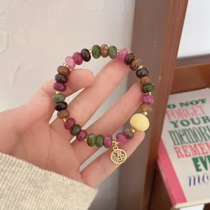 Colorful natural stone beaded bracelet with gold Fu charm and lotus pendant for women chic.