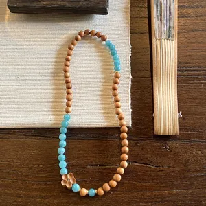 New Chinese retro sandalwood and blue crystal double-circle bracelet for women, elegant daily jewelry accessory.