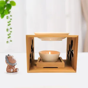Bamboo wood essential oil burner with ceramic dish and candle holder for home aromatherapy.