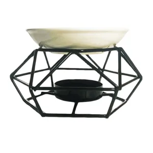 Quemador de aromaterapia de hierro geométrico con plato de cerámica para aceites y velas.