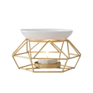 Gold iron geometric aromatherapy lamp with white ceramic essential oil burner dish and tealight.