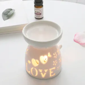 Ceramic essential oil burner with hollow love heart design for bedroom aromatherapy home decor