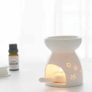 White ceramic essential oil burner aromatherapy candle holder for home bedroom relaxation use.
