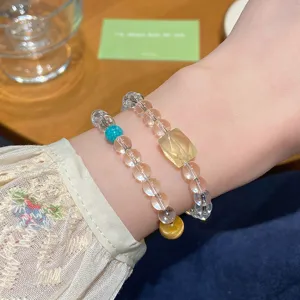 Close-up detail of double-layer crystal gemstone beaded bracelet showing clear polished beads.