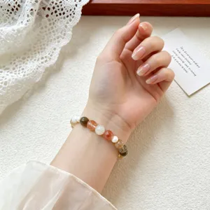 Exquisite rutilated quartz mixed beaded bracelet detail showcasing fine natural gemstone textures.