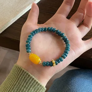 Detail shot of the new Chinese style vintage jadeite abacus bead bracelet with yellow agate.