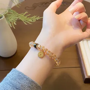 Neo-Chinese vintage crystal beaded bracelet with gold coin pendant, elegant hand jewelry.