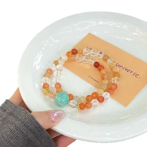 Natürliches Kristall Doppelkreis Armband mit Amazonasstein Perlen und Ethno Design.