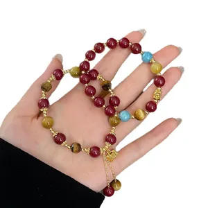 Bracciale in stile cinese vintage in cinnabar e occhio di tigre con lucchetto a nappa