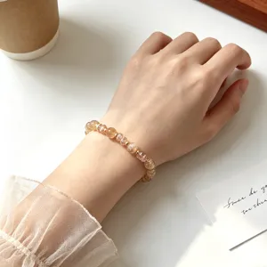Detailed shot of Chinese style natural yellow crystal beaded stretch bracelet for women.