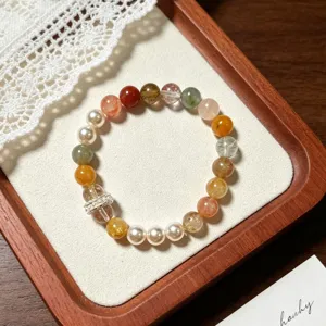 Close-up detail of a stunning multi-color crystal and pearl beaded bracelet, elegant and chic.