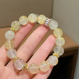 Detailed close-up shot of the natural yellow quartz bracelet with exquisite gold-toned spacers.