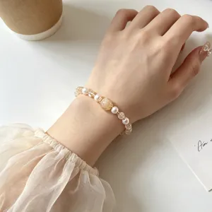 Elegant crystal pearl beaded bracelet for women, chic vintage style elastic jewelry accessory.