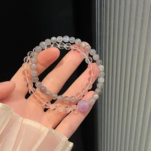 Elegant double layer natural crystal beaded bracelet with sparkling gemstone and purple accent.