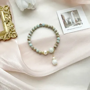 Vintage gemstone beaded bracelet with pendant, elegant literary style jewelry for women.