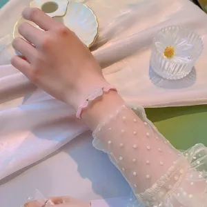 Charmant bracelet tresse Pixiu en cristal rose avec des perles de quartz fraise chic.
