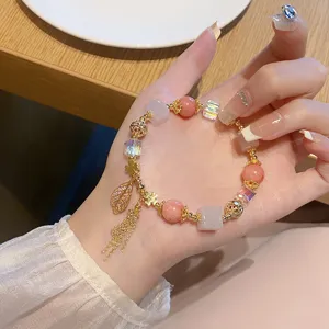 Retro sweet pink crystal bead bracelet with leaf tassel pendant, elegant fashion wrist jewelry.