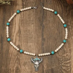 Boho turquoise bead necklace with bull skull pendant, vintage style jewelry for women.