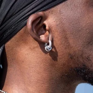 Men hip-hop paved diamond hoop earrings close up display highlighting detailed craftsmanship.