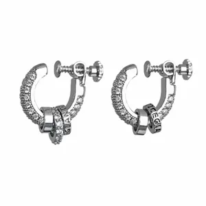 Detailed close-up of sparkling paved rhinestone screw hoop earrings with engraved metallic rings.