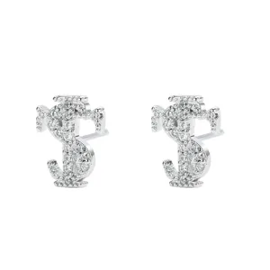 Close-up detail of iced-out dollar sign stud earrings, dazzling cubic zirconia in silver tone.