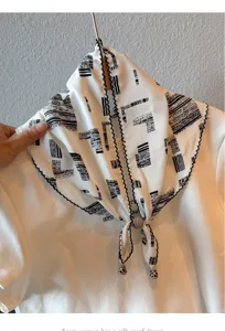 Detailed view of retro lace thin triangular scarf with beads, perfect summer boho accessory.