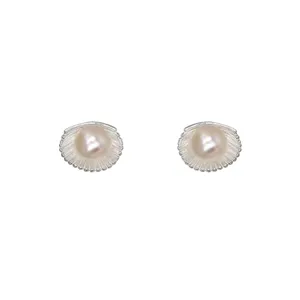 Pearl shell stud earrings detail close-up showing delicate texture and elegant design.