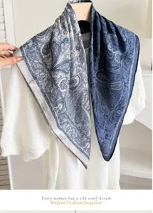 Detailed close-up shot of a blue paisley print square scarf featuring elegant vintage style.