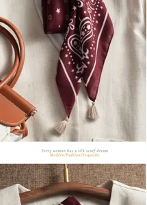 Detailed shot of retro maroon paisley silk scarf with delicate tassels, elegant textile texture.