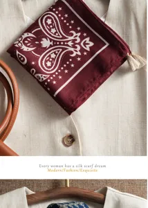 Close-up of the delicate paisley pattern and tassel detail on the vintage cotton linen scarf.